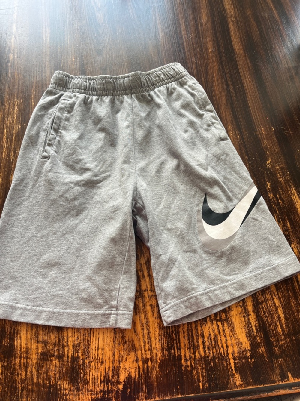 Nike Gray Kids Athletic Shorts with Black & White Swoosh Accent